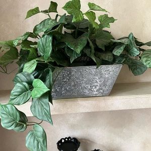 Beautiful Assorted attached Faux flower display in Silver Metal Container